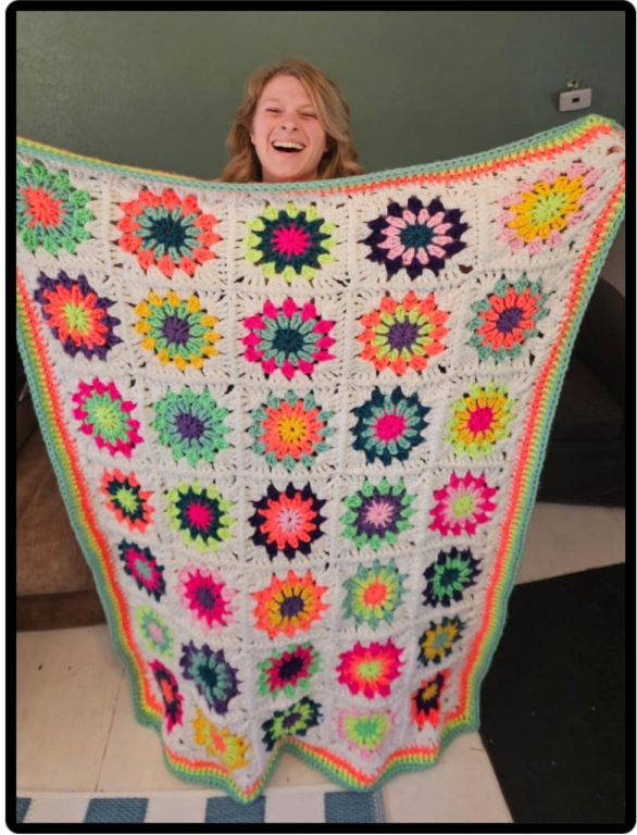 Skylar with her crocheted blanket